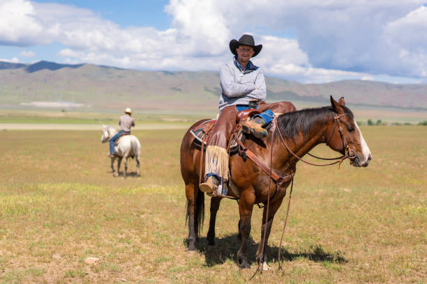 istock Ranchers on horses in Utah, USA 1085499894