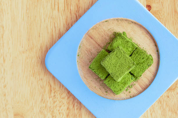 istock White chocolate fudge coatd with green tea powder 1085516946