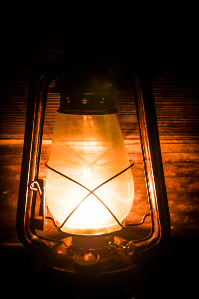 istock Kerosene lamp with old wooden wall 1085523268