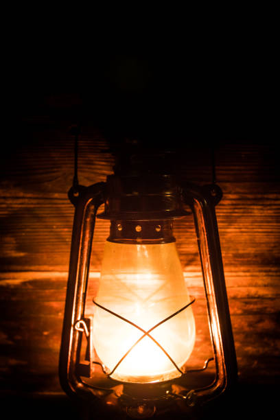 istock Kerosene lamp with old wooden wall 1085523296