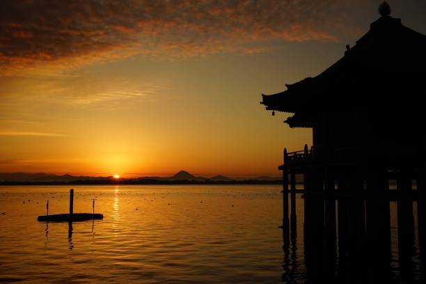 Sunrise on Lake Biwa in Japan Sunrise on Lake Biwa in Shiga, Japan. This area is traditionally called Oumi. It is one of Oumi 8 beautiful view spots(Oumi Hakkei). otsu city stock pictures, royalty-free photos & images