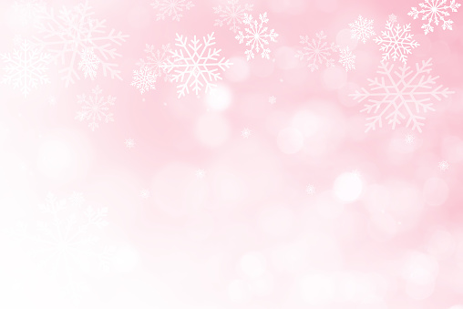 Pink Christmas background with snowflakes and bokeh, for copy space. Abstract snowflake background