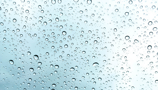 Close-up Rain Drop On Glass As Background