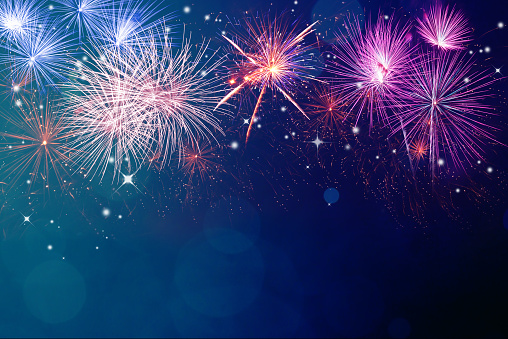 Abstract fireworks celebration on festive bokeh light background. Fireworks for copyspace and background
