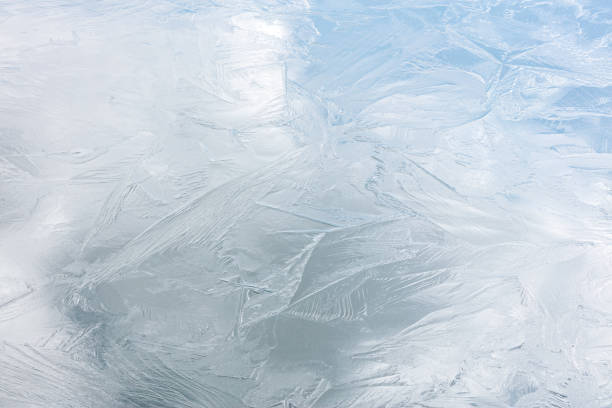 natural winter background of ice surface. frozen river texture