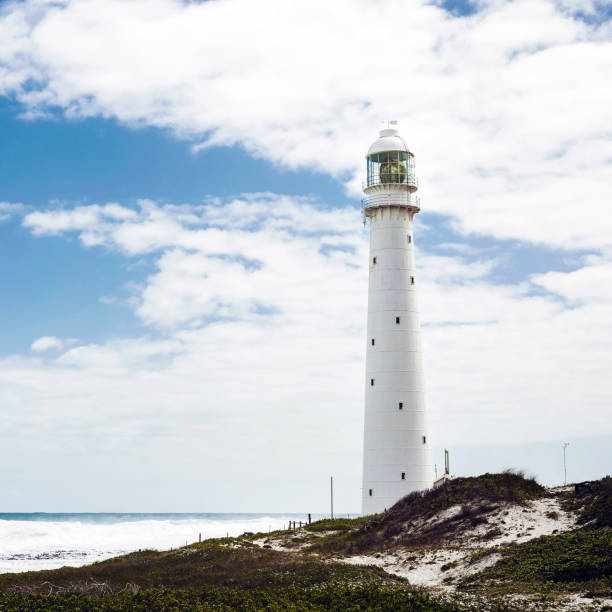 istock Lighthouse on the rugged Cape Town South Africa coastline 1085542480