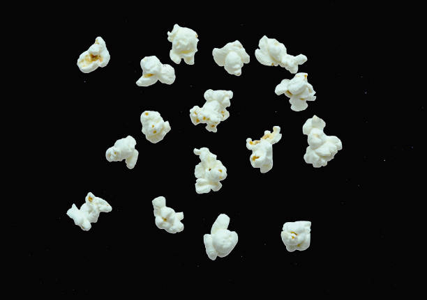 popcorn floating on night sky stock photo