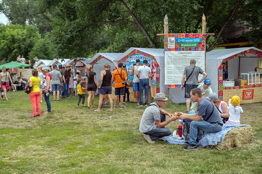 SHUSHENSKOE, Krasnoyarsk Territory, RF- July 14,2018: People buy ice cream and drinks in the pavilions, for the time of the annual Intl festival of music and crafts \