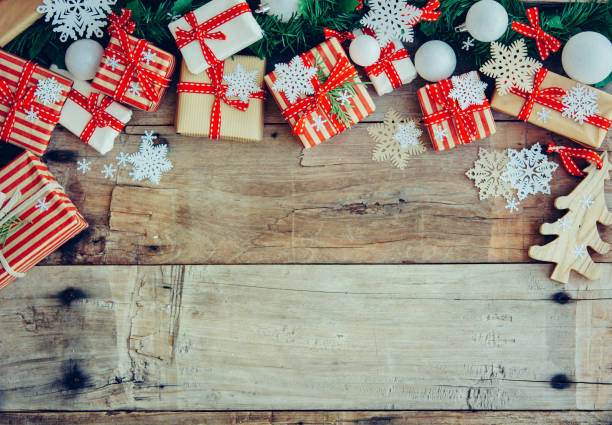 istock Christmas background with decorations and red gift boxes on the wooden board 1085548370