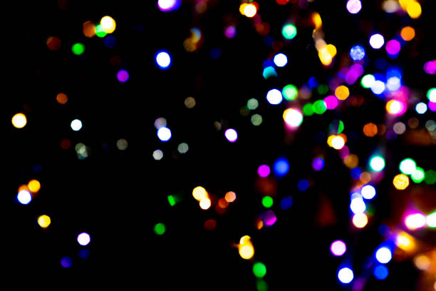 istock Colorful bokeh shining random abstract black background. 1085554964