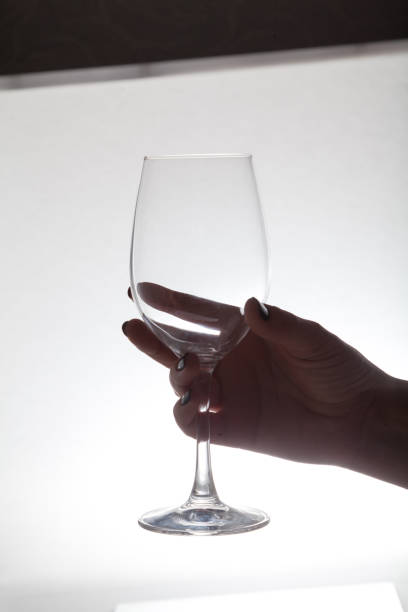 istock Hand holding  glass wine glass 1085561184