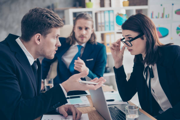 istock Three business people, young lady boss in glasses, having debate 1085582250