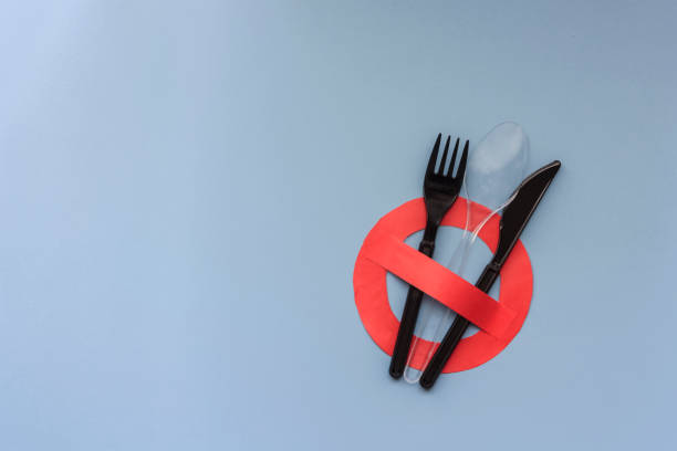 istock No access with a set of plastic cutlery on a light blue background 1085585008