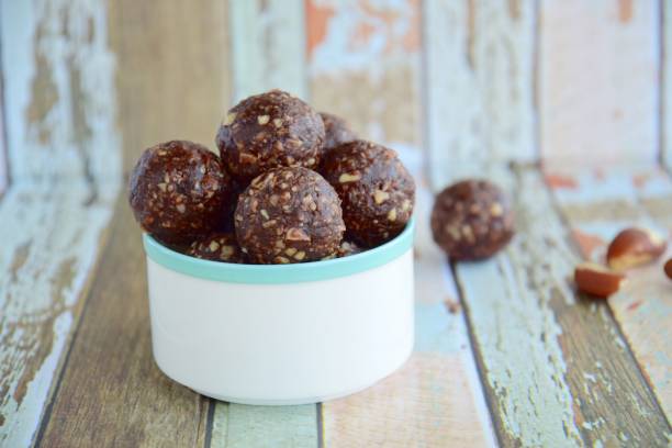 istock Brazil nut chocolate energy balls on pastel background 1085590162
