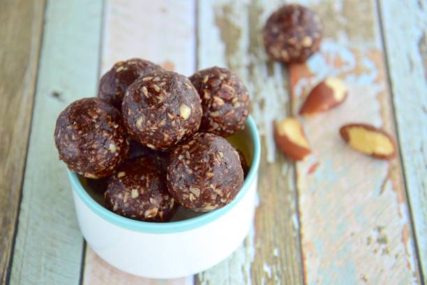 istock Brazil nut chocolate energy balls on pastel background 1085590204