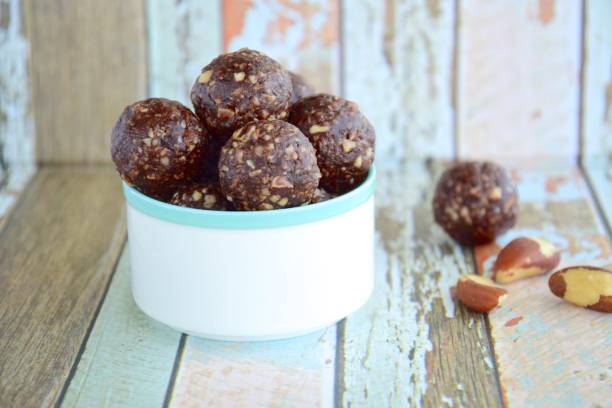 istock Brazil nut chocolate energy balls on pastel background 1085590222