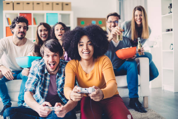 istock Colleagues playing video games in the office relax room 1085591864