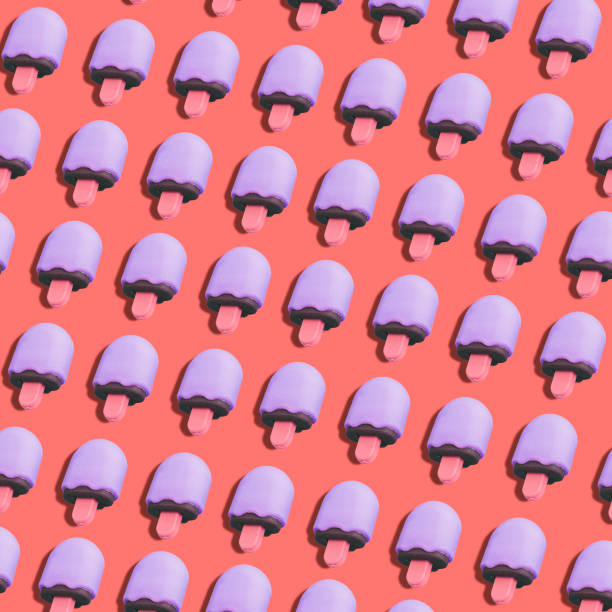 istock purple ice cream pattern on coral color background. 1085592458