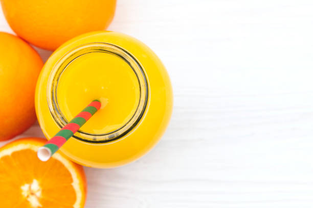 istock Orange juice and oranges from above 1085597504