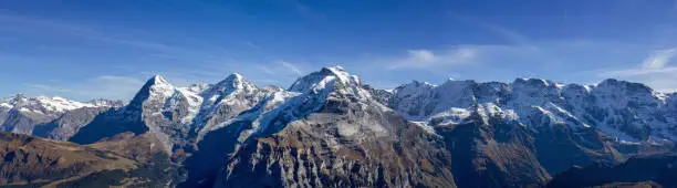 The famous three peaks and its extension: Eiger, Mönch und Jungfrau, and Gletscherhorn, Ebnifluh, Mittags-, Gross- und Breithorn in Berne Alps, Switzerland
