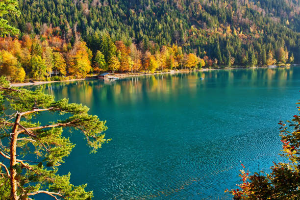 istock Beautiful blue mountain lake on a warm fall season day 1085601026