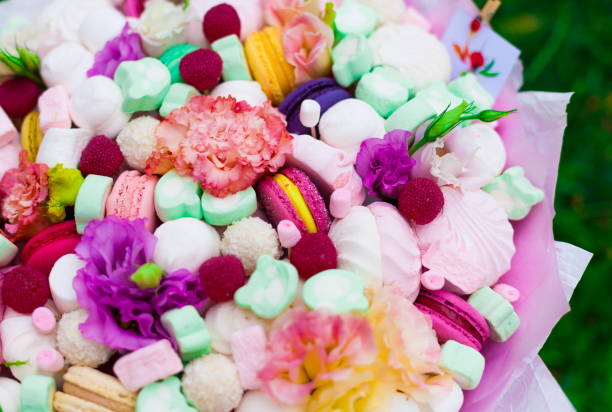 istock Flowers, fruit bouquet,  pink carnation, marshmallows, macaroons, nature 1085605634