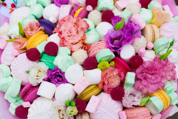 istock Flowers, fruit bouquet,  pink carnation, marshmallows, macaroons, nature 1085606086