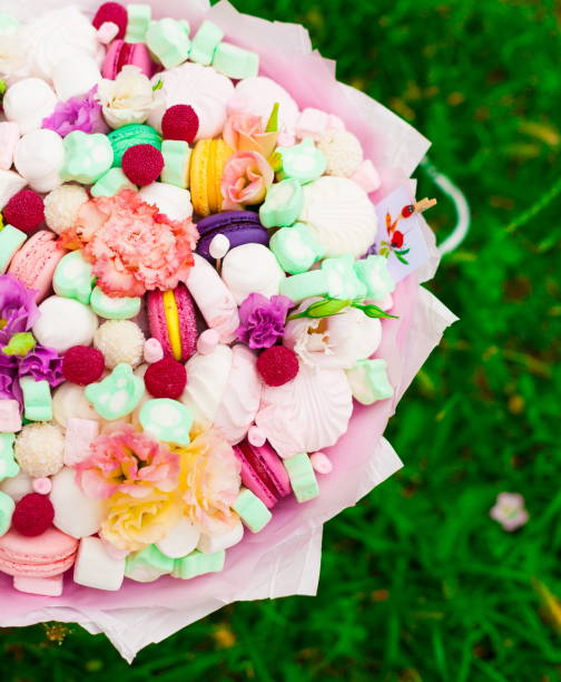 istock Flowers, fruit bouquet,  pink carnation, marshmallows, macaroons, nature 1085606140