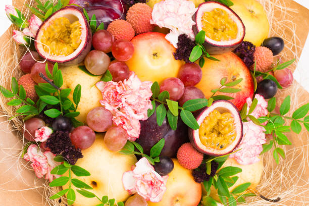 istock Flowers, fruit bouquet, white isolated, apples, grapes, passionfruit, carnation 1085606798