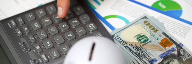istock Male hand push key silver calculator is 1085613432