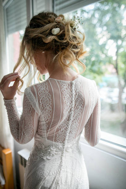 Beautiful bride posing near the window