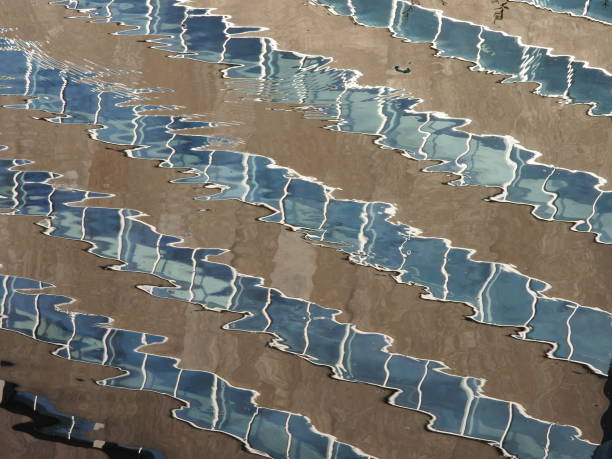 istock Reflection building in running water. Fast shutter high speed fotography. Abstract art. 1085618550