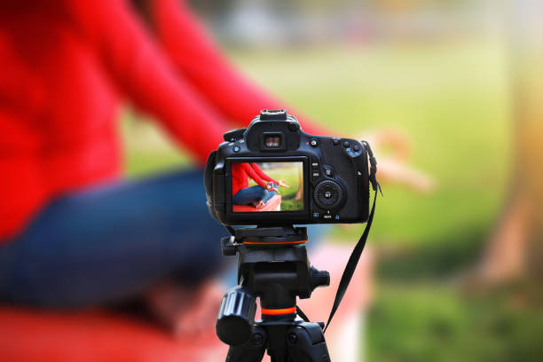 Camera capturing an image outdoor in nature during sunset.