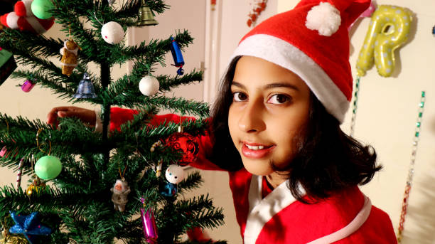 istock Child portrait near Christmas tree 1085625596