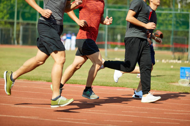 istock young asian athletes running racing on track 1085627212