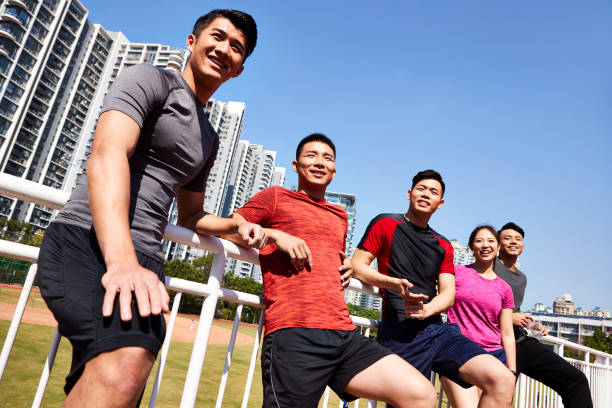 istock happy asian athletes relaxing 1085628968