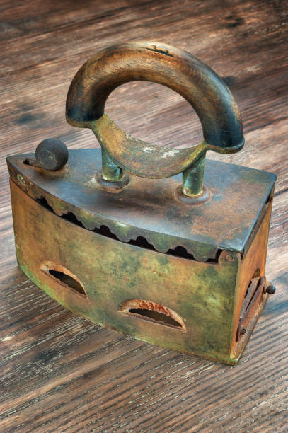 istock Vintage rusty iron on wooden table 1085631636