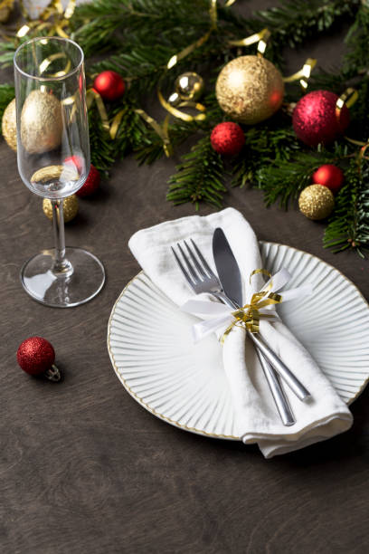 istock Christmas place setting with fork and knife, ribbon and christmas decorations 1085631864