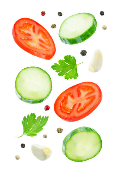 istock Flying Cucumber slices with tomato slices 1085632074