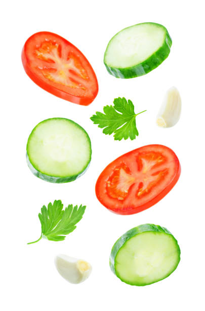 istock Flying Cucumber slices with tomato slices 1085632080