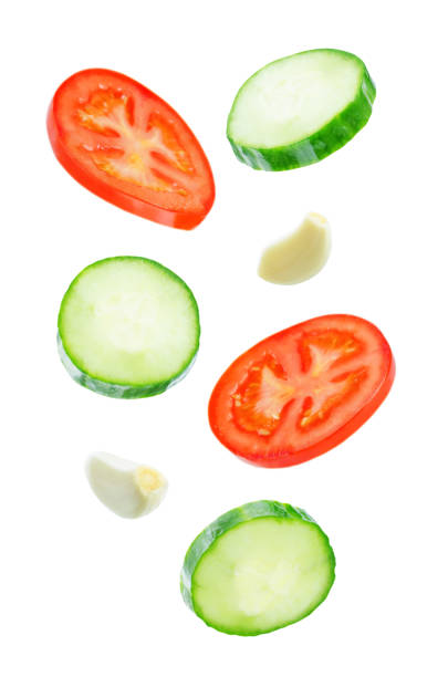 istock Flying Cucumber slices with tomato slices 1085632082