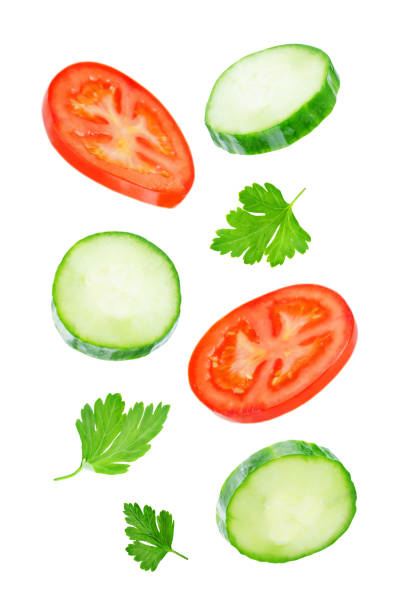 istock Flying Cucumber slices with tomato slices 1085632094