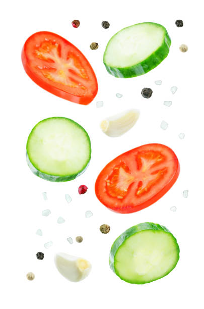 istock Flying Cucumber slices with tomato slices 1085632116