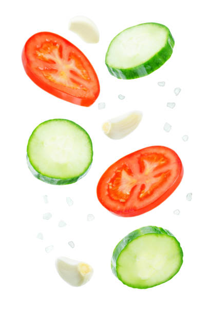 istock Flying Cucumber slices with tomato slices 1085632126
