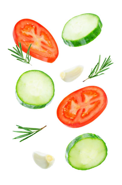 istock Flying Cucumber slices with tomato slices 1085632144