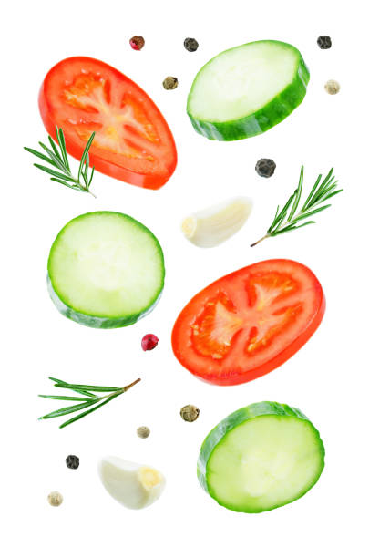 istock Flying Cucumber slices with tomato slices 1085632146