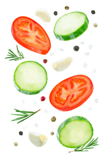 istock Flying Cucumber slices with tomato slices 1085632148