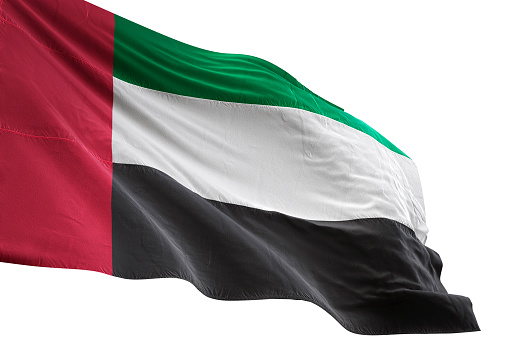 Fondo blanco aislado que agita cerca de la bandera de Emiratos Árabes Unidos photo