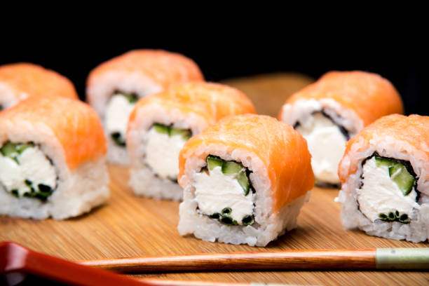 istock Philadelphia roll with wasabi, ginger and soy sauce. 1085634490
