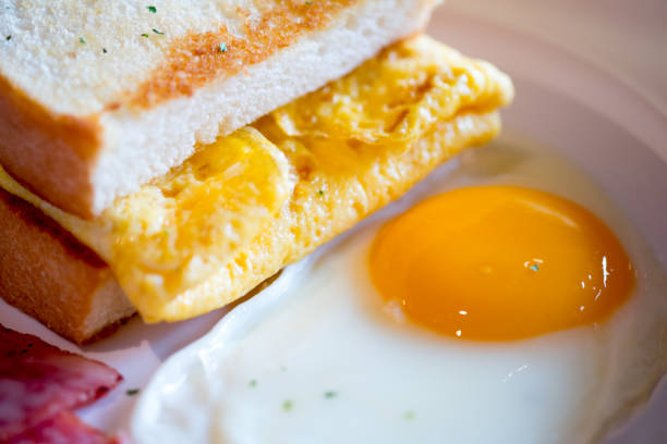 istock Close up breakfast with toast and fried yolk yellow eggs. Breakfast concept 1085644668